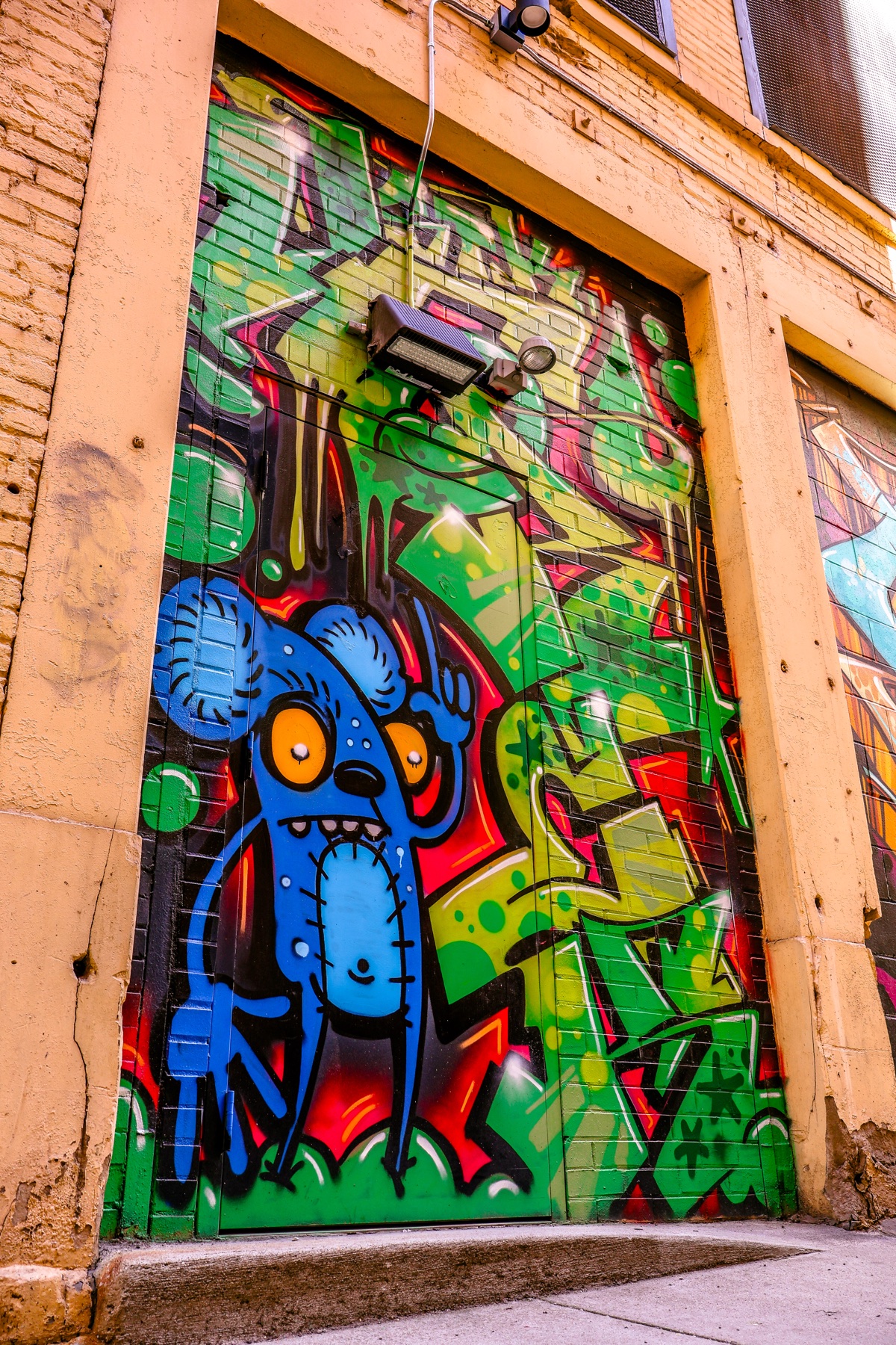 Original photograph of a colorful character mural